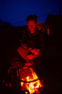 Vladimir Mosolov, our guide, drinking coffee near by the fire outside the hut in Kronotsky National Park.